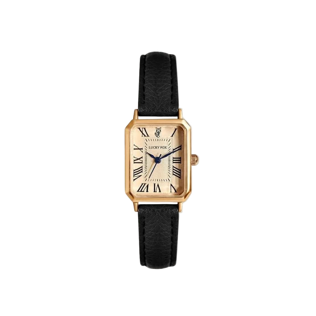 Gold watch with black strap on a white background